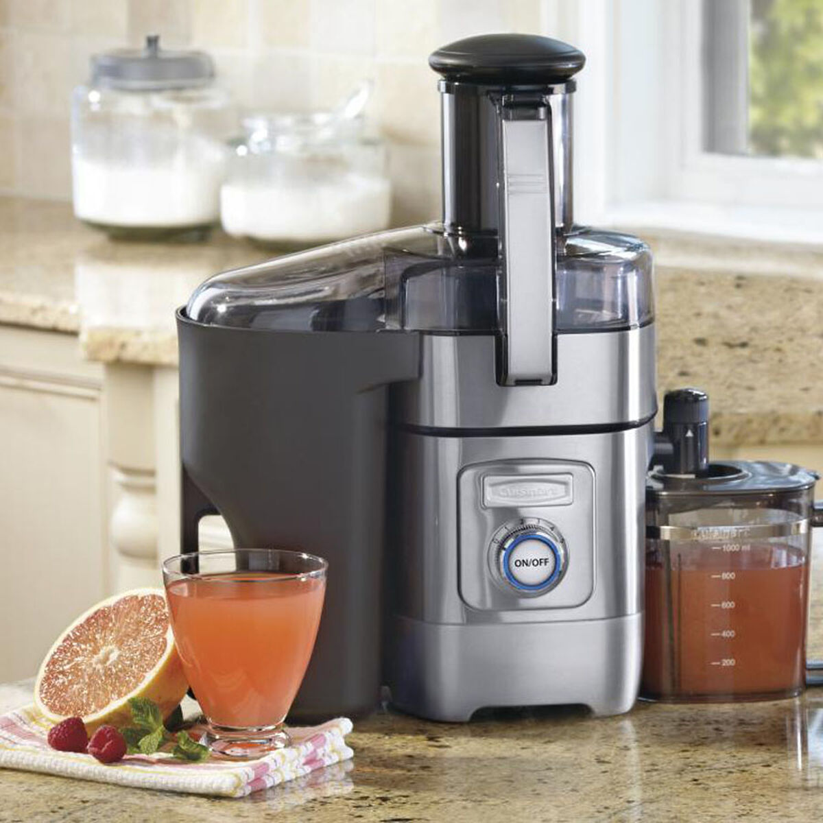 Cuisinart CJE-1000 stainless-steel centrifugal juice extractor with a separate pulp container and juice pitcher