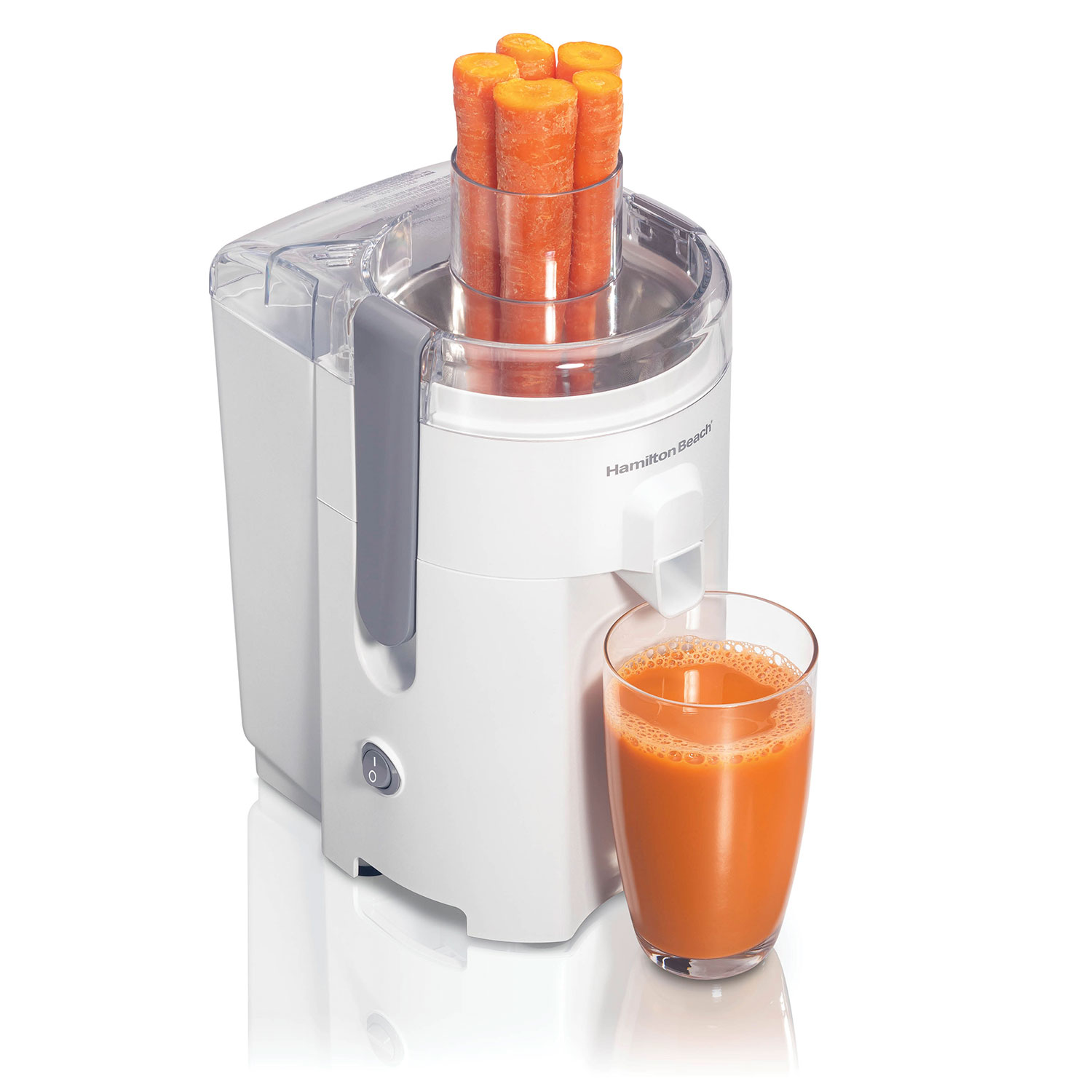 Official Hamilton Beach 67501 white HealthSmart compact juicer with carrots in its chute and a glass below