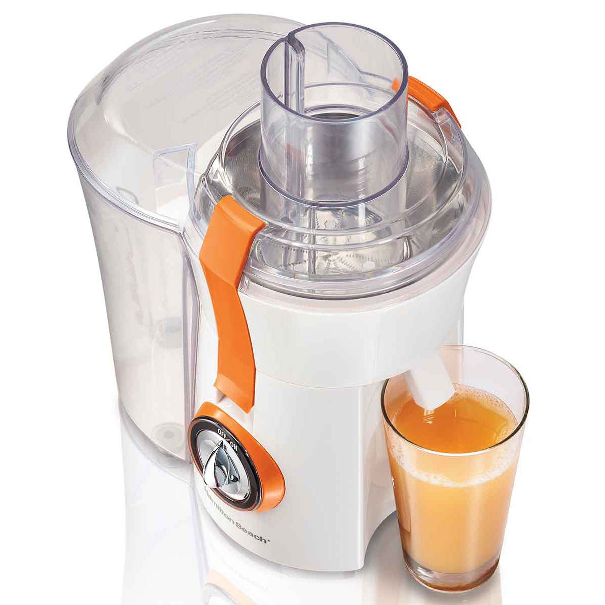 Hamilton Beach 67603 Big Mouth centrifugal juicer with white body, orange locking latches, separate side pulp bin and glass below the spout