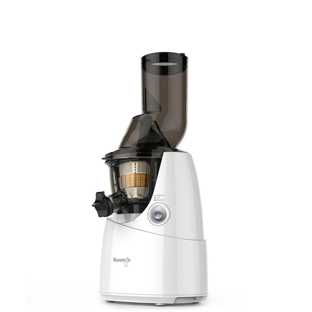 White Kuvings B6000 household juicer with its tall feed chute and clear juicing bowl.