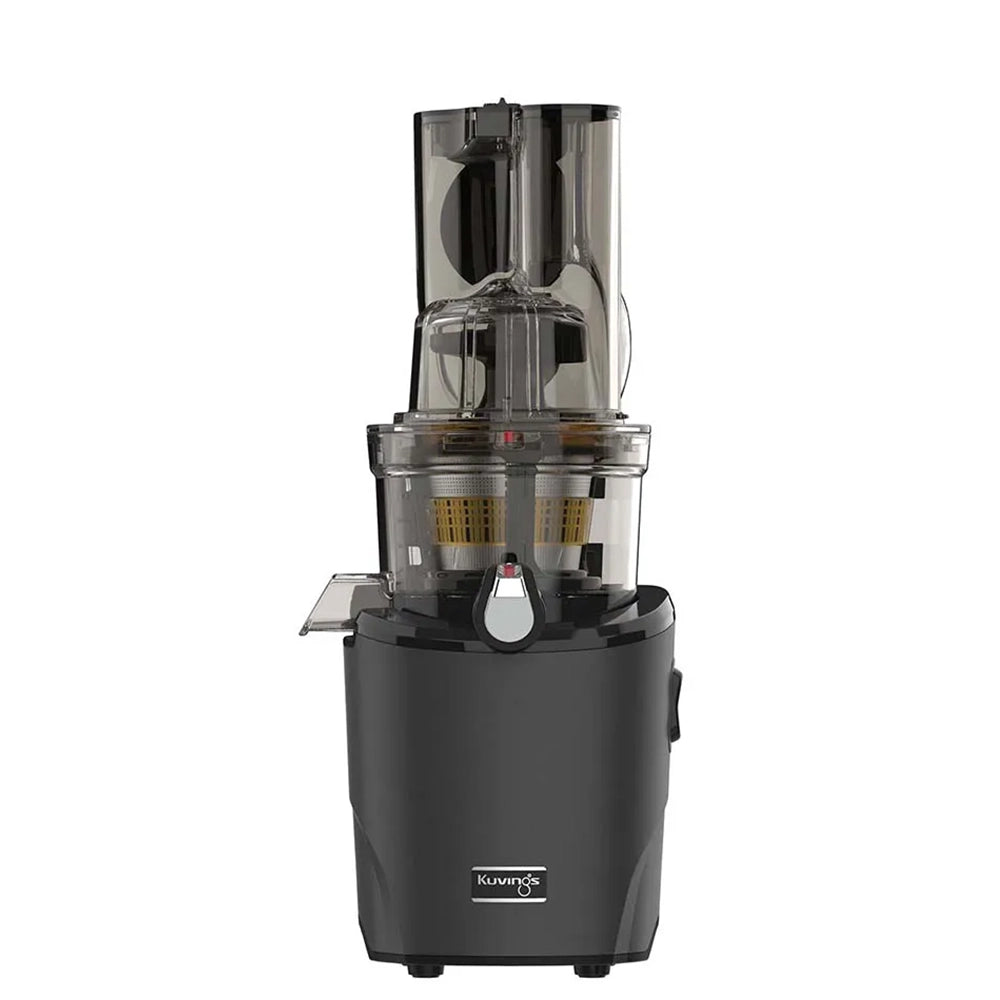 Black Kuvings REVO830 household juicer with its tall feed assembly and clear juicing bowl.