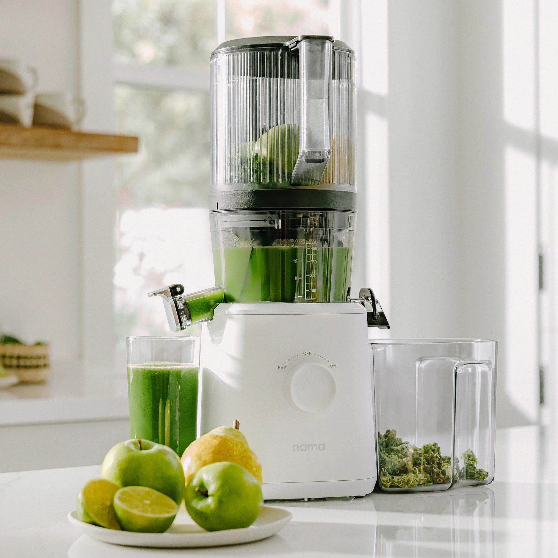 Nama J2 SJ200 cold-press auger juicer in its standard juicing arrangement with hopper, chamber, juice and pulp containers