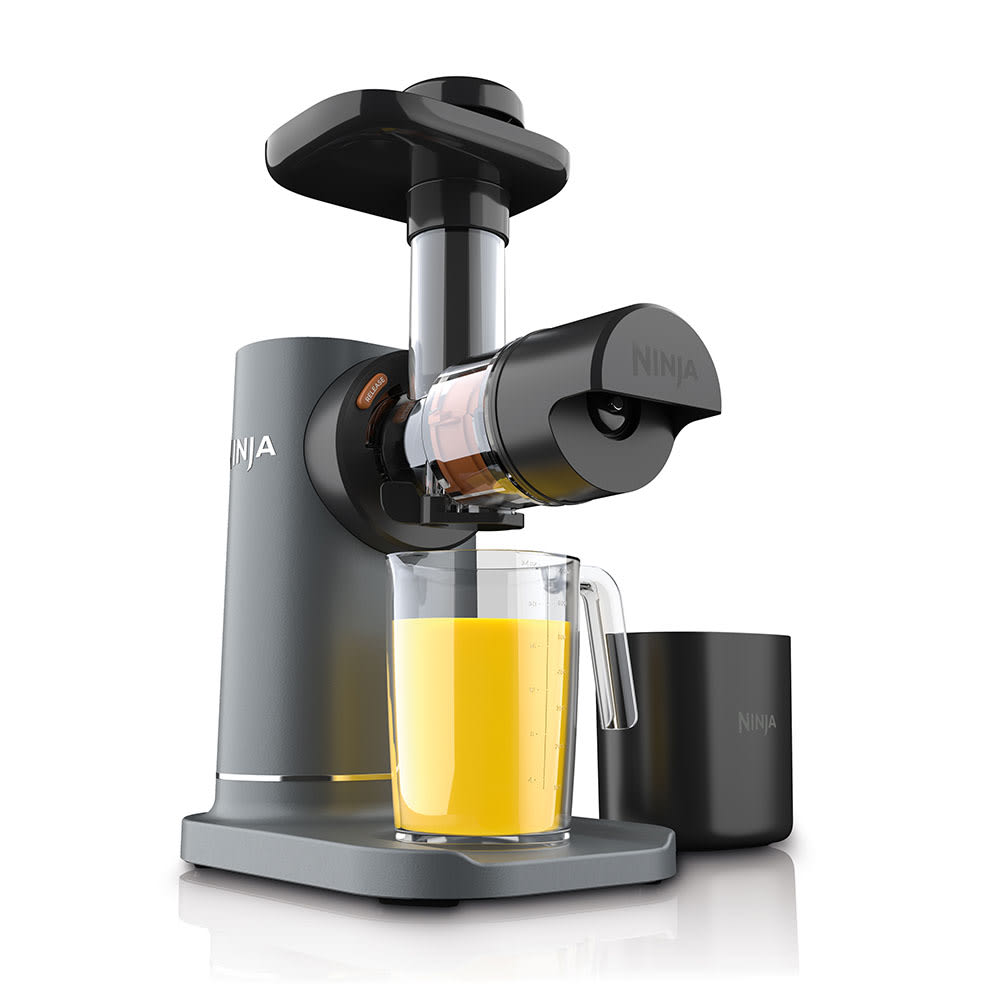 Ninja NeverClog JC151 Machine Gray cold press juicer with its feed pusher, juice jug, and separate pulp container